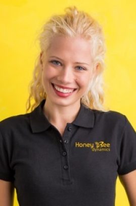 Woman in black polo T-shirt on yellow background